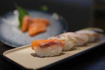 Maki Sushi Rolls on bamboo board isolated on White background with clipping path. High quality photo