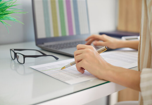 Woman recording, analysing stock market, female accountant calculator reporting financial transactions to calculate expenses, expenditures pay bills taxes online, managing home family, company budget 