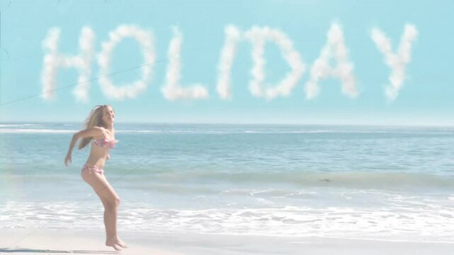Cloud HOLIDAY skywriting appearing over beach woman sprinting then leaping on shore boosting travel