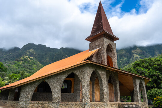 Vaitahu catholic church in Tahuata, Marquesas Islands, French Polynesia, mountain backdrop