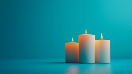 Calming candle arrangement on teal background