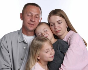 Fototapeta premium Cute family with closed eyes posing on white background