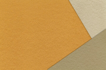 Fototapeta premium Abstract orange, beige and brown paper background with copy space. Template for presentation, banner, card design