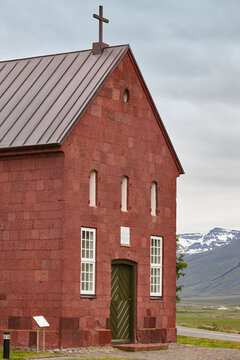 Picturesque red sandstone church. Holar chapel, 1763 year.  North Iceland