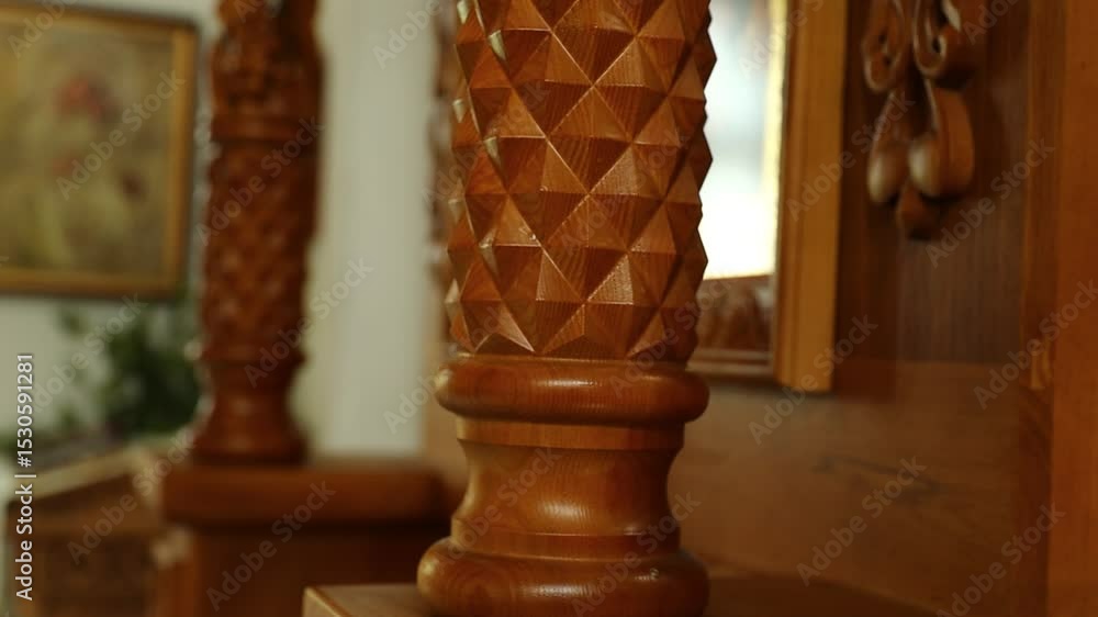 Poster a close-up view of a wooden object placed on a shelf, possibly decorative or functional