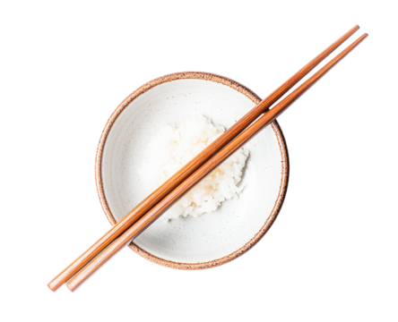 Overhead view of cooked white rice in a small bowl with wooden chopsticks, transparent background