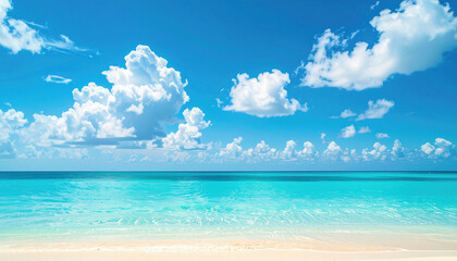 Crystal-clear turquoise waters gently touch the soft sandy shore under a bright blue sky filled with fluffy white clouds, creating a perfect tropical paradise scene.
