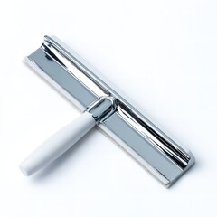 A close up shot of a shiny silver squeegee with a white handle on a plain white background surface