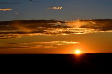 sunset over the horizon in the steppe