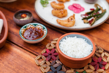 Classic steamed white rice served as a side in Vietnamese cuisine. Simple top-down food shots with rice in bowls and plates