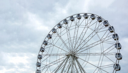 Ferris wheel on a summer day, close-up.