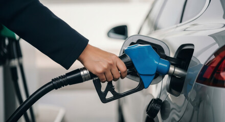 Refueling action at a gas station city location automotive content urban environment close-up viewpoint energy concept for efficient travel