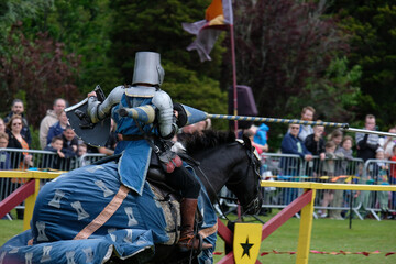 Knght Jousting Tournament. Knight in medieval armour on a horse. 