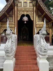 Editorial use only. Detailed view of a Buddhist temple entrance in Thailand