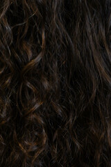 Hair restoration treatment enhancing natural curls in a salon