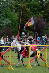 Knght Jousting Tournament. Knight in medieval armour on a horse. 