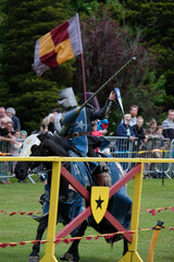 Knght Jousting Tournament. Knight in medieval armour on a horse. 