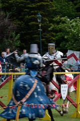 Knght Jousting Tournament. Knight in medieval armour on a horse. 