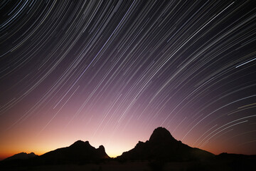 A startrail sprials above the matterhorn of Africa, the Spitzkoppe near Swakopmund, Namibia.