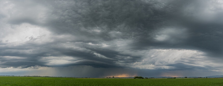Panoramic scene of severe storm development over Bavaria Germany with menacing dark clouds and turbulent weather conditions