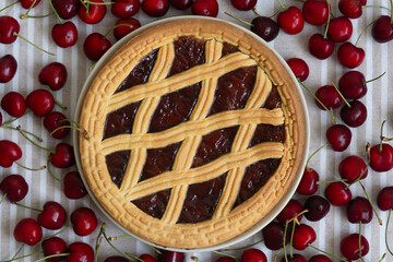 Cherry pie with a golden lattice crust and fresh cherries