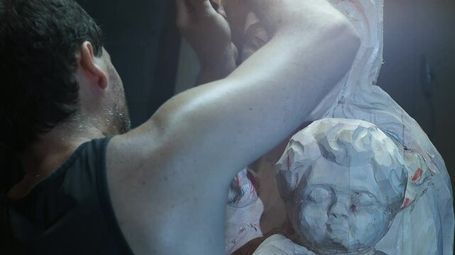 Professional woodcarver creating detailed sculpture, carefully chiseling delicate wood chips with precision, revealing intricate artistic design in slow motion craftsmanship