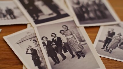 Nostalgic Collection of Black and White Vintage Family Photographs Laying on a Wooden Surface - Powered by Adobe