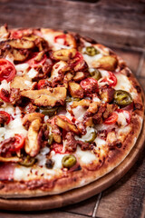 Gyros Pizza with jalapeno pepper, cherry tomatoes and mozzarella cheese. Soft focus. Close up.	