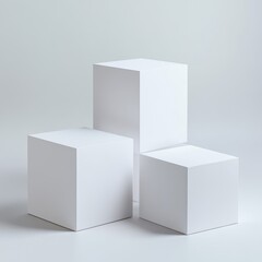 Three white cubes on a light gray background