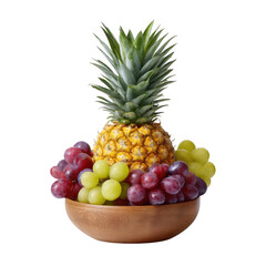 A fresh pine stands tall atop a wooden bowl surrounded by vibrant green and purple grapes, creating an appealing arrangement against a clean white background.