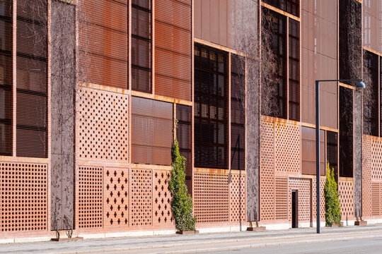 Mixed materials in a contemporary facade with soft tones and vertical rhythm, Ørestad, Copenhagen, perfect for architecture and business presentation