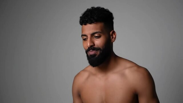 Charismatic Moroccan Man with Amber Eyes &ndash; Confident Portrait with Full Beard in Dramatic Backlit Studio