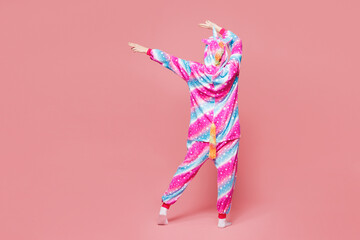 Obraz premium Full body back rear view young woman she wear domestic costume with hoody and animal ears look aside on area dancing isolated on plain pastel light pink background studio portrait. Lifestyle concept.