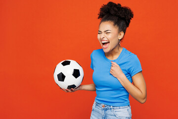 Young woman fan wear blue t-shirt cheer up support football sport team hold in hand soccer ball...