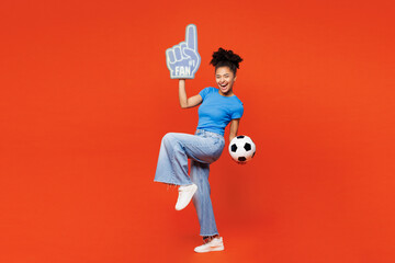 Full body young woman fan she wear blue t-shirt foam 1 glove finger up cheer up support football...