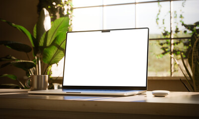 Laptop with blank screen on a bright desk, surrounded by sunlight and greenery, suggesting productivity and peace. CGI render