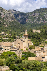 Obraz premium Valldemossa village on Mallorca island with church holiday at Serra de Tramuntana portrait format in Spain