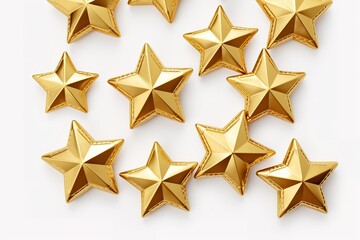 Gold stars isolated against a white background creating a festive and elegant composition