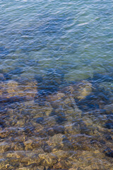 Stunning view of Naples’ waterfront featuring Castel dell’Ovo and Mount Vesuvius in the background under a clear blue sky