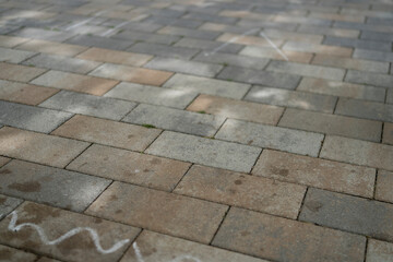 Brickwork with a chalk line drawn on it. Children's art concept on the sidewalk