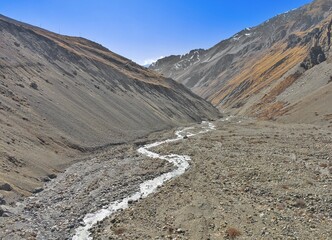 Himalayas, Nepal - The famous hiking on the roof of the world called Annapurna Circuit in Himalaya range mountain, with little village, buddhist stupa and mountains of 8000 meters.