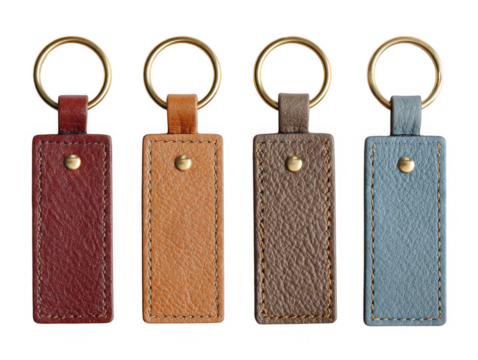 Four leather keychains isolated on transparent background