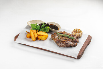 Portion of gourmet grilled beef steak with potato and sauce