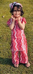 little cute girl in a pink dress