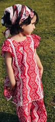 young girl in a red dress Pakistan