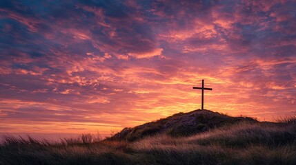 Obraz premium A breathtaking scene of a cross, standing atop a grassy hill, silhouetted against a stunning sunset that fills the sky with shades of red, orange, and purple.