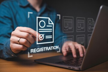 Person interacting with a digital registration document on a laptop.
