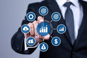 A person interacts with a graphical interface displaying various business icons.