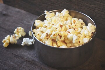 Pop corn on wood background