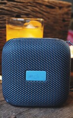 Bluetooth speaker on wood table